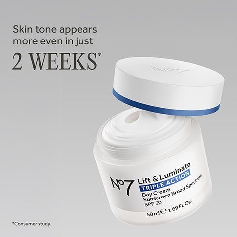 Open white jar of face cream labeled No7 Lift & Luminate TRIPLE ACTION Day Cream Sunscreen SPF 30.