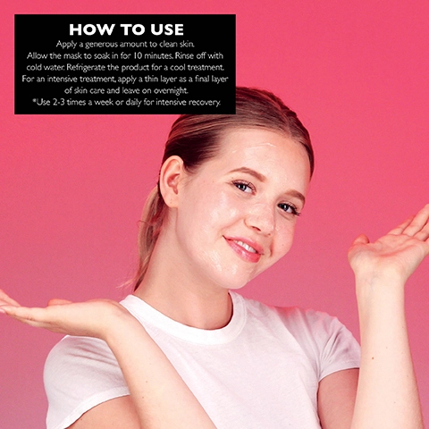 Image 1 - A smiling person with a clean face and a skincare mask applied holds their hands up against a pink background, with instructions for use displayed in black text above them that reads HOW TO USE Apply a generous amount to clean skin. Allow the mask to soak in for 10 minutes. Rinse off with cold water. Refrigerate the product for a cool treatment. For an intensive treatment, apply a thin layer as a final layer of skin care and leave on overnight. *Use 2-3 times a week or daily for intensive recovery.