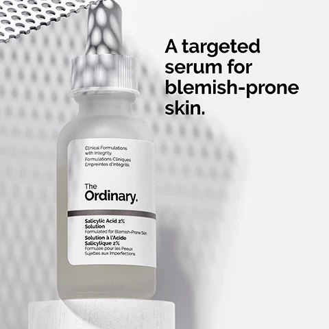 Image 1 - A clear glass bottle of The Ordinary Salicylic Acid 2% Solution serum is displayed on a light background, with text that reads A targeted serum for blemish-prone skin.
              Image 2 - A close-up image of a clear water-based serum with bubbles, featuring text that reads 2% salicylic acid targets textural irregularities while removing dead skin cells and Water-based serum texture.
              Image 3 - A close-up of a mans face showing his cheek and finger pointing at it, with text that reads Apply daily in the evening. Use a small amount for general use.
              Image 4 - Image shows various skincare products arranged in three horizontal categories: PREP with cleansers and toners, TREAT featuring water-based serums and oils, and SEAL with suspensions and moisturizers; text includes category titles and specific product types.