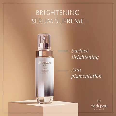 Image 1 - A cosmetic bottle labeled Brightening Serum Supreme is featured on a light brown background, accompanied by the text Surface Brightening and Anti pigmentation.
              Image 2 - A woman with long brown hair is applying a skincare product on her cheek while holding a bottle in her other hand, with the text Visibly improves dark spots & clarify skin tone and the logo clé de peau BEAUTÉ visible.
              Image 3 - A woman with long brown hair and blue eyes is gently touching her face, looking directly at the camera, with text overlay that says In 2 weeks, intensity of dark spots is reduced* *Self-evaluation results from 119 women after eight weeks of use.