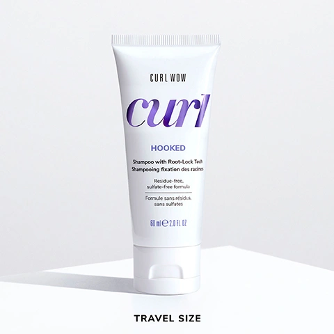Image 6 - A travel-sized bottle of Curl Wow Hooked shampoo displays a white tube with purple text, highlighting curl and HOOKED, and includes details about its residue-free, sulfate-free formula, with additional text in French and the label TRAVEL SIZE.