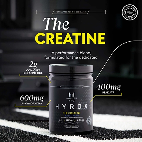 A black container labeled HYROX with the title The CREATINE and a description highlighting it as a performance blend, featuring 2g CON-CRET CREATINE HCL, 400mg PEAK ATP, and 600mg ASHWAGANDHA, set on a textured surface with a blurred background.
