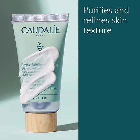 Image 1 - A tube of Caudalie exfoliating cream with a wooden cap is shown with a dollop of cream on it, next to text that reads Purifies and refines skin texture.
              Image 2 - A green tube of CAUDALIE exfoliating cream is shown alongside green grapes, mint leaves, and a smear of the cream, with text indicating that it contains volcanic sand microbeads, organic menthol, and organic grape water, along with product volume information.
              Image 3 - Image shows two skincare product tubes side by side: on the left, a mint green tube labeled Deep Cleansing Exfoliator which states it deeply purifies with volcanic sand microbeads for all skin types, and on the right, a dark green tube labeled Buffing Cream which states it gently purifies with jojoba microbeads for sensitive skin.
              Image 4 - A person holding a tube of Caudalie exfoliating cream, with a small amount of cream on their hand, against a pale green background; the visible text reads Apply to damp skin 1-2 times a week.