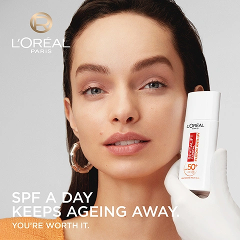 Image 1 - A woman with clear skin looks directly at the camera while a gloved hand presents a white bottle of LOréal Revitalift Clinical Fluido Anti-UV SPF 50+, with visible text LOréal Paris, Revitalift Clinical, Fluido Anti-UV, SPF 50+, UVA UVB, SPF A DAY KEEPS AGEING AWAY. YOURE WORTH IT. Image 2 - A hand in a white glove holds a white bottle of LOréal Paris Revitalift Clinical Anti-UV Fluid SPF 50+ UVB + UVA Very High Protection, displayed against an orange and yellow background with text that states A DERM-VALIDATED DAILY ANTI-AGEING SPF, CREATED BY VALIDATED WITH DERMATOLOGISTS LORÉAL PARIS, PROTECT BROAD SPECTRUM SPF 50+ PREVENT EARLY AGEING SIGNS, and CORRECT REDUCE FINE LINES FADE DARK SPOTS. Image 3 - Four LOréal Revitalift Vitamin C skincare products including a cleanser, toner, serum, and anti-UV fluid are displayed on an orange background, with the text YOUR VITAMIN C BRIGHTENING ROUTINE, 1 FOAMING CLEANSER, 2 PORE- PERFECTING TONER, 3 TONE-PORE-LINE SERUM, 4 ANTI-UV FLUID SPF 50+. Image 4 - A radiant orange sphere wrapped in a flowing, transparent white mesh against an orange gradient background, accompanied by the text POWERED BY PATENTED SPF TECHNOLOGY, ANTIOXIDANT VITAMIN C, SPF 50+ [UVB+UVA FILTERS], and at the bottom FLAMENT F. ET AL. IMPACT ON FACIAL SKIN AGEING SIGNS OF A 1-YEAR STANDARDIZED PHOTOPROTECTION OVER A CLASSICAL SKINCARE ROUTINE IN SKIN PHOTOTYPES II-VI INDIVIDUALS: A PROSPECTIVE RANDOMIZED TRIAL. J EUR ACAD DERMATOL VENEREOL. 2023; 37: 2090-2096, with an R logo inside a circle. Image 5 - A woman with dark hair and a gold ring on her finger gently touches her face, looking towards the viewer, with a white background, featuring the text LORÉAL PARIS VISIBLE RESULTS CLINICALLY PROVEN, 93% SAY DARK SPOTS ARE LESS VISIBLE, 92% SAY FINE LINES ARE REDUCED, and Clinically approved by 125 women aged from 18 to 60 y.o. Application once a day for 28 days. Image 6 - The image shows three white LOreal Revitalift Clinical skincare bottles, including two serum bottles and one anti-UV fluid, resting on a yellow to orange gradient background with white product spilled around them, accompanied by the text YOUR DAILY ROUTINE FOR 4X BRIGHTER SKIN* STEP 1 12% PURE VITAMIN C SERUM REVIVE RADIANCE IN JUST 1 USE** 2X LESS VISIBLE PORES*** STEP 2 DAILY SPF 50+ PREVENT EARLY AGEING SIGNS, with product labels reading LOREAL PARIS REVITALIFT CLINICAL DERM-GRADE 12% VITAMIN C + E + SALICYLIC SERUM and LOREAL PARIS REVITALIFT CLINICAL ANTI-UV FLUID SPF 50+ UVA UVB VERY HIGH PROTECTION, and additional small print: *CLINICAL STUDY: 50 WOMEN USING THE ROUTINE VERSUS 50 WOMEN USING A MOISTURISER, AFTER 8 WEEKS. **VITAMIN C SERUM CLINICAL SCORAGE ON RADIANCE, 63 SUBJECTS. ***VITAMIN C SERUM CLINICAL SCORAGE, PORE VISIBILITY VS BASELINE, 63 SUBJECTS, and an R brand logo. Image 7 - Four LOreal SPF products, including three bottles and one stick, are arranged on a light blue background with product swatches and connecting descriptive lines, displaying text: PICK YOUR PERFECT DAILY SPF, with products identified as 100% INVISIBLE LOREAL PARIS REVITALIFT CLINICAL ANTI-UV FLUID 50+ UVA UVB VERY HIGH PROTECTION (VITAMIN C SPF 50+ FLUID), GLOW-BOOSTING LOREAL PARIS BRIGHT REVEAL DAILY FLUID SUNSCREEN 50 VERY HIGH PROTECTION (GLOWY SPF50 FLUID), ANTI DARK SPOTS LOREAL PARIS BRIGHT REVEAL DARK SPOT UV FLUID 50+ UVA UVB VERY HIGH PROTECTION (NIACINAMIDE SPF 50+ FLUID), and ON-THE-GO LOREAL PARIS BRIGHT REVEAL DARK SPOT UV STICK 50+ UVA UVB VERY HIGH PROTECTION (OVER MAKEUP SPF 50+ STICK), along with an R logo. Image 8 - A man with dark hair and a beard applies a light cream to his cheek, with text promoting Invisible on all skin tones, No white cast, Non-sticky, Ultra-light texture.