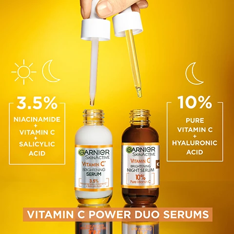 Image 1 - Two serum bottles by Garnier are pictured on a bright yellow background; the left bottle is labeled with 3.5% Niacinamide + Vitamin C + Salicylic Acid and the right bottle is labeled with 10% Pure Vitamin C + Hyaluronic Acid, with the text VITAMIN C POWER DUO SERUMS displayed below them.
              Image 2 - A woman with smooth skin holds two droppers with a yellow-orange background, conveying a skincare message that highlights the products ability to fight dark spots day and night. FIGHTS THE APPEARANCE OF DARK SPOTS DAY & NIGHT.
              Image 3 - Two women pose for a photo, one with short blonde hair holding a serum bottle and the other with long dark hair also holding a serum, with the text BRIGHTENING POWER DUO SERUMS DOUBLE THE VITAMIN C POWER prominently displayed above and below them.
              Image 4 - An image of two Garnier serum bottles on a bright yellow background, with text stating 8/10 agree its the best serum theyve ever used, and logos indicating cruelty-free and vegan formulas.
              Image 5 - A close-up of a woman applying a dropper of serum to her cheek, with text on the image that reads HOW TO USE? and instructions for use: USE 1 FULL PIPETTE, APPLY ON CLEAN SKIN, MASSAGE GENTLY.
              Image 6 - Image features two serum bottles labeled Garnier Skin Active Vitamin C with a brown bottle for nighttime serum and a white bottle for daytime serum; text highlights that Garnier products are cruelty-free, vegan, and that the bottles are made from 25% recycled glass.