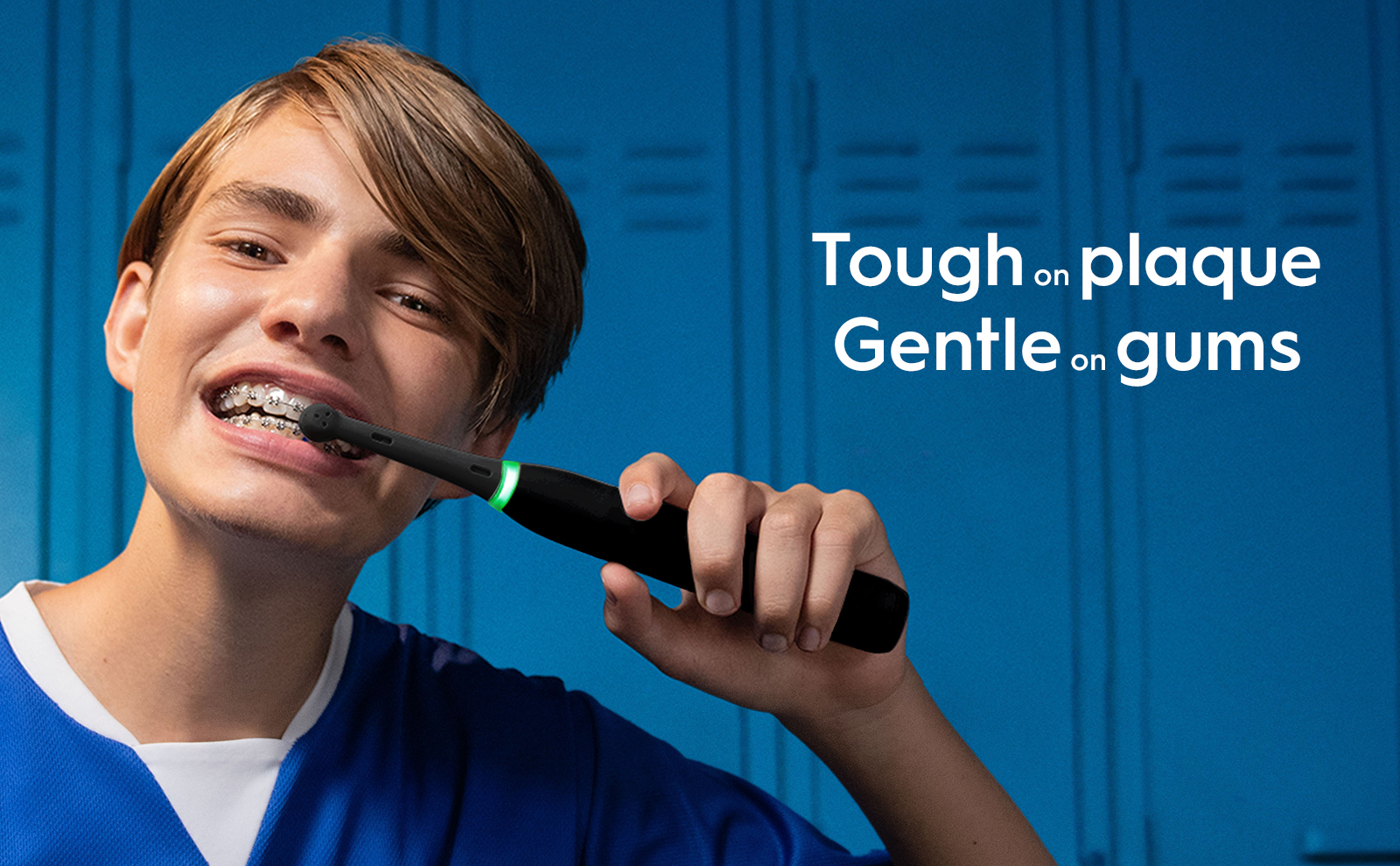 Teenager using an Oral-B iO electric toothbrush, highlighting its effectiveness on plaque and gentleness on gums, even with braces.