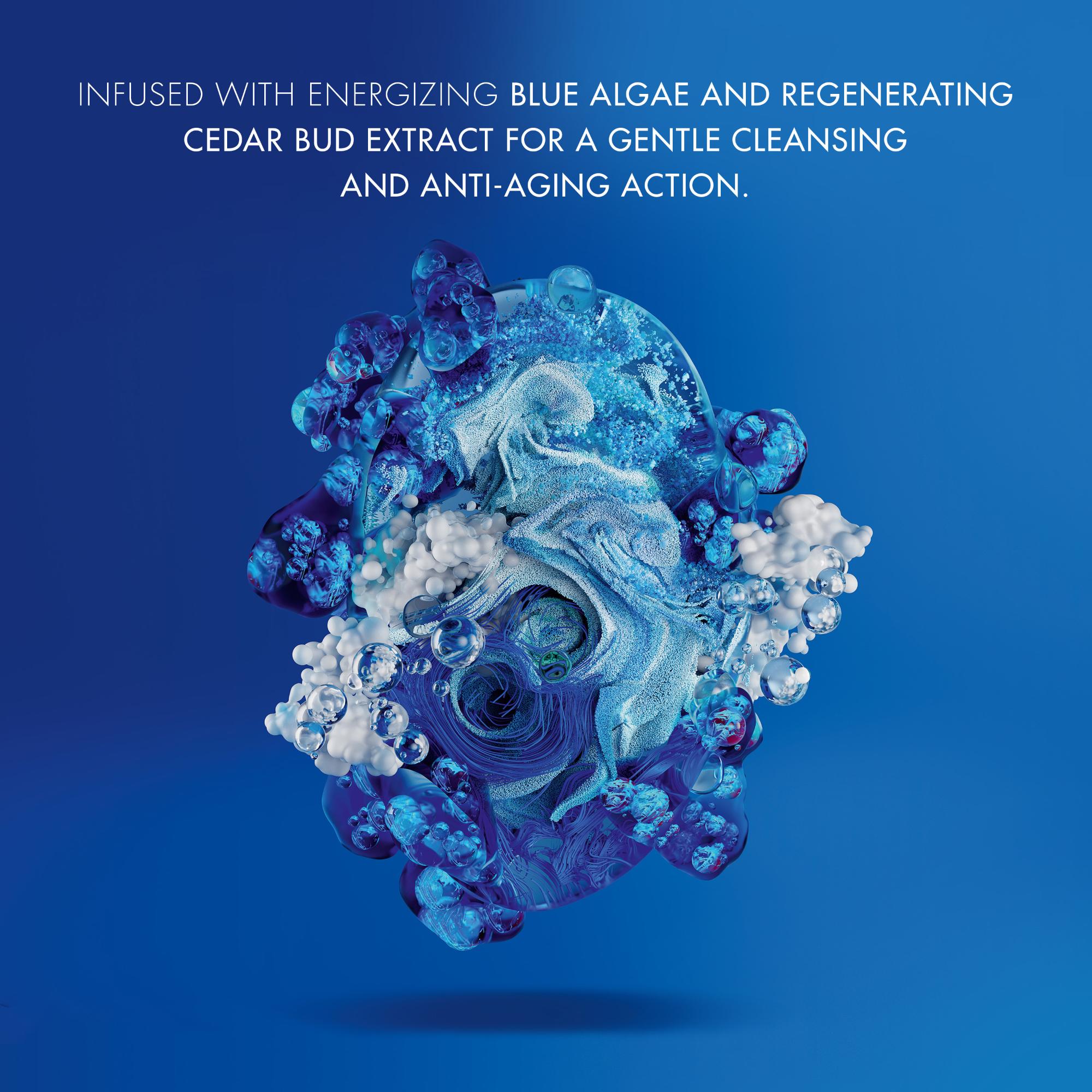 Image GIF3 - An abstract swirl of blue liquid, particles, and clear bubbles mixed with white cloud-like elements against a deep blue background, with the text INFUSED WITH ENERGIZING BLUE ALGAE AND REGENERATING CEDAR BUD EXTRACT FOR A GENTLE CLEANSING AND ANTI-AGING ACTION.