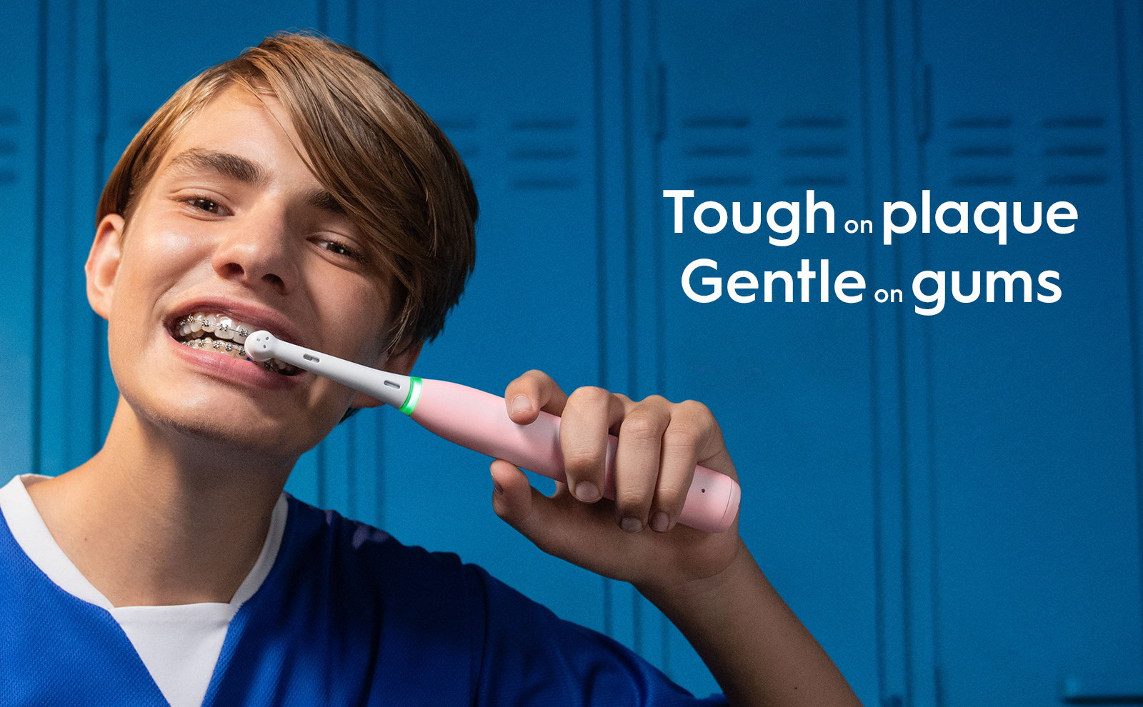 Teenager using an Oral-B iO electric toothbrush, highlighting its effectiveness on plaque and gentleness on gums, even with braces.