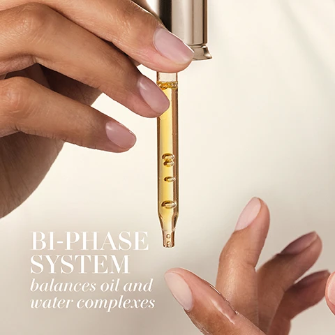 Image 1 - A hand holding a dropper with a golden liquid above another hand, with visible text saying BI-PHASE SYSTEM balances oil and water complexes.
              Image 2 - A close-up of a woman’s face highlighting her skin texture and freckles, with the words ABSORBS Instantly displayed prominently.
              Image 3 - A close-up image of golden oil droplets floating in liquid with the text Infinity Oil Complex at the top and a list of oils including Cranberry Oil, Olive Oil, Camelina Oil, Rapeseed Oil, Sweet Almond Oil, Jojoba Oil, Meadowfoam Oil, and Sea Buckthorn Oil below.
              Image 4 - A close-up image of a blue-green background featuring translucent bubbles with bright reflections, accompanied by the text Marine and Peptide Powered and Hydro Fusion Complex.