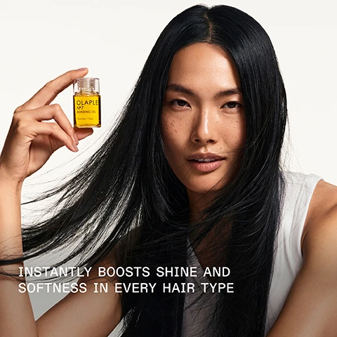 Image 1 - A person with long, straight black hair is holding a small bottle of OLAPLEX No. 7 bonding oil, with the text below reading INSTANTLY BOOSTS SHINE AND SOFTNESS IN EVERY HAIR TYPE.
              Image 2 - A close-up image of a glass bottle filled with golden hair oil tipped slightly, with a drop of oil falling from the spout, featuring the text 125% MORE SHINE* *Compared to bleached hair without application of OLAPLEX N°7 Bonding Oil™.
              Image 3 - Image shows two OLAPLEX hair care products, the No. 6 Bond Smoother in a white bottle on the left and the No. 7 Bonding Oil in a clear bottle on the right, with text indicating to pair them for smooth styling and noting their benefits.
              Image 4 - A comparison of hair texture and color with the left side labeled BEFORE showing frizzy, dull hair and the right side labeled AFTER displaying smooth, shiny curls; additional text at the bottom notes UNRETOUCHED IMAGES and describes the hair care process used.
              Image 5 - Image showing a comparison of hair texture before and after using hair care products, with the left side displaying frizzy, unkempt hair labeled BEFORE and the right side showing smooth, shiny hair labeled AFTER. Visible text includes UNTOUCHED IMAGES* and *Results may vary. Results achieved by cleansing with N°4 Bond Maintenance® Shampoo, conditioning with N°5 Bond Maintenance® Conditioner, then applying OLAPLEX N°7 Bonding Oil™ to damp hair before styling and again to dry hair.
              Image 6 - A comparison image showing two sections of hair labeled BEFORE on the left side with frizzy hair texture, and AFTER on the right side with well-defined curls; visible text includes UNRETOUCHED IMAGES and a note about results achieved with specific hair products.