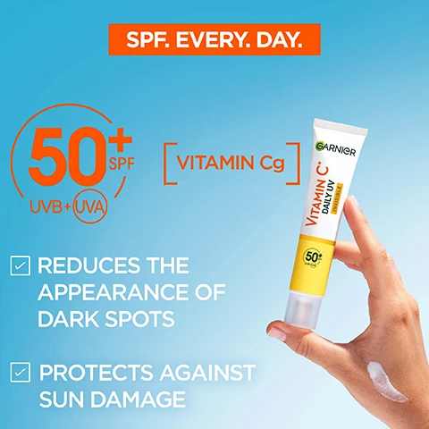 Image 1 - An advertisement for Garnier Vitamin C Daily UV cream featuring a hand holding the tube against a blue background, with visible text indicating SPF 50+, benefits of reducing dark spots, and sun damage protection.
              Image 2 - Image of a Garnier sunscreen tube labeled Vitamin C Daily UV Invisible with a yellow background, highlighting very high protection against UVA, UVB, and long UVA, featuring checkmarks for non-greasy, non-oily, non-comedogenic, and lightweight & invisible formula, as well as no residues and no white cast.
              Image 3 - A hand is holding a tube of Garnier Vitamin C cream, while another hand is receiving a small amount of the cream, with the background showing a gradient of blue; visible text includes HOW TO APPLY? and TWO FINGER RULE FOR WHOLE FACE & NECK.
              Image 4 - Image shows two tubes of Garnier Vitamin C Daily UV sunscreen on a bright yellow background, one labeled Glow with a peach-colored cream and the other labeled Invisible with a white cream, each accompanied by arrows pointing to text descriptions, including Mineral pigments, suitable for all skin tones and Invisible & lightweight formula, no white cast.