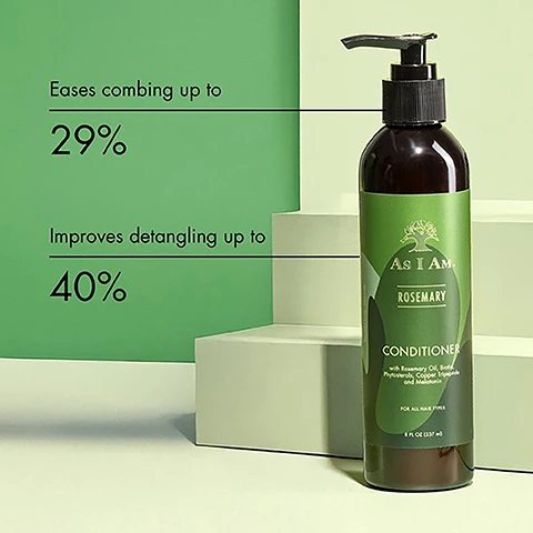 Image 1 - A bottle of As I Am Rosemary Conditioner is displayed on light-colored steps against a green background, with text indicating it eases combing up to 29% and improves detangling up to 40%.
              Image 2 - A person holds a bottle of rosemary conditioner labeled As I Am with icons indicating it is vegan and cruelty-free, sulfate-free, and has a natural fragrance.
