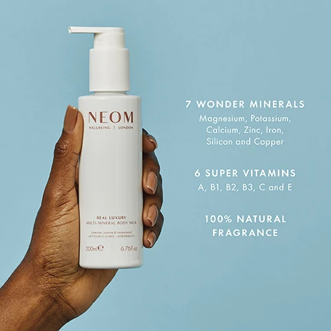 Image 1 - A hand holds a white bottle of body milk with text NEOM WELLBEING | LONDON REAL LUXURY MULTI-MINERAL BODY MILK Lavender, Jasmine & Sandalwood LAIT POUR LE CORPS - KÖRPERMILCH 200ml e 6.76fl oz and text on the blue background 7 WONDER MINERALS Magnesium, Potassium, Calcium, Zinc, Iron, Silicon and Copper 6 SUPER VITAMINS A, B1, B2, B3, C and E 100% NATURAL FRAGRANCE. Image 2 - Person applying white cream to their arm. Text reads 98% AGREED THAT THEIR SKIN FELT MOISTURISED AFTER JUST ONE USE* *Independent blind study on 60 people, after initial use. Image 3 - A white pump bottle of NEOM body milk is shown on a blue background with a swirl of lotion, featuring the text NEOM WELLBEING | LONDON REAL LUXURY MULTI-MINERAL BODY MILK Lavender, Jasmine & Sandalwood LAIT POUR LE CORPS - KÖRPERMILCH 200ml e 6.76fl oz FEATHERLIGHT FORMULA AND TEXTURE PROVIDES UP TO 48 HOURS OF HYDRATION* *Proven via clinical testing.