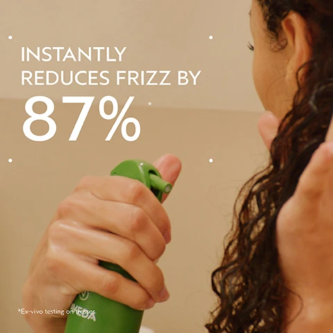 Image 2 - A person holds a green spray bottle, about to spray their dark curly hair, with text overlaid that reads Instantly reduces frizz by 87%* and *Ex-vivo testing on hair tresses. Image 3 - A before and after image showing the back of a persons head with shoulder-length reddish-brown hair; the left side, labeled BEFORE, shows dull, less defined curly hair, and the right side, labeled AFTER, shows shinier, more defined, bouncy curls; visible text includes Unwashed Hair and Results with Be Curly Advanced™ Shampoo, Intensive Curl Perfecting Masque, Curl Perfecting Primer, and Curl Enhancing Cream. Blow dried with diffuser and finished with Control Paste™. Image 4 - A close-up of three dark purple kokum fruits with green leaves against a white and dark green background, with text that reads KOKUM SEED BUTTER DEEPLY NOURISHES, CONDITIONS, DETANGLES. Image 5 - A split image shows a before and after comparison of dark curly hair from behind; on the left, labeled BEFORE and Unwashed Hair, the hair appears dry and frizzy, while on the right, labeled AFTER, the hair displays moisturized, defined curls, with additional text stating Results with Be Curly Advanced™ Co-Wash, Conditioner, Curl Perfecting Primer, and Curl Defining Gel. Blow dried with diffuser and finished with Nutriplenish™ Multi-Use Hair Oil. Image 6 - An infographic on a dark green background shows three steps for a hair care routine with circular images depicting wet hair, a hand dipping into a jar of product, and a collection of green Aveda Be Curly Advanced products, with text that reads HOW TO USE, 01 CLEANSE, Be Curly Advanced™ Shampoo, 02 CONDITION, Be Curly Advanced™ Intensive Curl Perfecting Masque, 03 STYLE, Be Curly Advanced™ Curl Perfecting Primer and Curl Enhancer Cream Control Paste™. Image 8 - The image shows a dark green leafy background featuring three white certification logos: a circular 100% Vegan logo with a V, a Certified B Corporation logo, and a Cruelty Free International logo with a leaping rabbit.