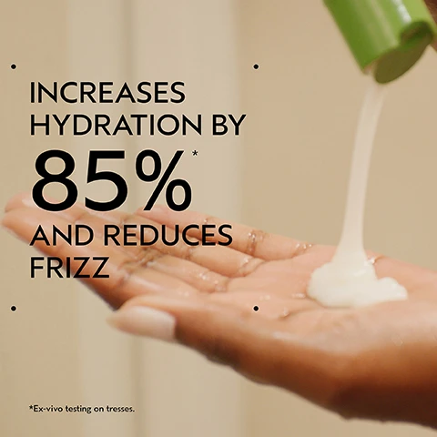 Image 2 - A hand catches a stream of white product pouring from a green bottle top, with the text Increases hydration by 85%* and reduces frizz, and a footnote that reads *Ex-vivo testing on tresses. Image 3 - A close-up of three dark purple kokum fruits with green leaves on a white background, set against a dark green frame, with the text Kokum Seed Butter and Deeply Nourishes, Conditions, Detangles. Image 4 - A split image shows the back of a persons head with dark, textured hair; the left side shows undefined, frizzy curls while the right side shows hydrated, well-defined bouncy curls. BEFORE AFTER Unwashed Hair Results with Be Curly Advanced™ Co-Wash, Conditioner, Curl Perfecting Primer, and Curl Defining Gel. Blow dried with diffuser and finished with Nutriplenish™ Multi-Use Hair Oil. Image 5 - The image shows a three-step hair care routine on a dark green background, featuring HOW TO USE, 01 CLEANSE with hands washing curly hair and text Be Curly Advanced TM Co-Wash, 02 CONDITION with a hand squeezing white product from a green tube and text Be Curly Advanced TM Conditioner, and 03 STYLE with various green and brown Aveda styling products and text Be Curly Advanced TM Curl Perfecting Primer, Be Curly Advanced TM Coil Definer Gel, Nutriplenish TM Multi-Use Hair Oil. Image 6 - A split image shows a woman with dark skin smiling, before and after a hair treatment; on the left, her hair is a voluminous, undefined afro, and on the right, it is transformed into defined, bouncy, moisturized curls, slightly shorter, with visible text reading BEFORE, AFTER, Unwashed Hair, and Results with Be Curly Advanced™ Co-Wash, Conditioner, Curl Perfecting Primer, and Curl Defining Gel. Blow dried with diffuser and finished with Nutriplenish™ Multi-Use Hair Oil. Image 8 - Three white certification logos are displayed against a background of green leaves: a circular logo with a V symbol surrounded by the text 100% VEGAN repeated twice, a logo with a B in a circle and the text Certified B Corporation, and a logo featuring a leaping rabbit and stars with the text Cruelty Free INTERNATIONAL.