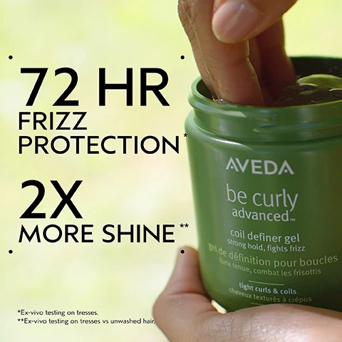 Image 2 - A hand reaches into a green jar of Aveda Be Curly Advanced Coil Definer Gel, with text on the image reading 72 HR FRIZZ PROTECTION*, 2X MORE SHINE**, *Ex-vivo testing on tresses., **Ex-vivo testing on tresses vs unwashed hair., coil definer gel strong hold, fights frizz, gel de définition pour boucles forte tenue, combat les frisottis, tight curls & coils, cheveux texturés à crépus. Image 3 - The image shows three dark purple kokum fruits with green leaves against a white and dark green background, with text that reads Kokum Seed Butter, Deeply Nourishes, Conditions, Detangles. Image 4 - A split-screen image displays a womans hair transformation; on the left, before treatment, she has a large, voluminous afro, and on the right, after treatment, her hair is styled into defined curls, with visible text reading BEFORE, AFTER, Unwashed Hair, and Results with Be Curly Advanced™ Co-Wash, Conditioner, Curl Perfecting Primer, and Curl Defining Gel. Blow dried with diffuser and finished with Nutriplenish™ Multi-Use Hair Oil. Image 5 - The image illustrates a hair care routine on a dark green background with three circular photos: the first shows hands massaging a scalp with product, the second shows a hand squeezing conditioner from a green tube into a palm, and the third shows hands holding various hair care products; visible text reads How To Use, 01 CLEANSE Be Curly Advanced Co-Wash, 02 CONDITION Be Curly Advanced Conditioner, 03 STYLE Be Curly Advanced Curl Perfecting Primer, Be Curly Advanced Coil Definer Gel, Nutriplenish Multi-Use Hair Oil. Image 6 - A split image shows a persons dark, afro-textured hair from the back; the left side shows dry, undefined hair labeled BEFORE Unwashed Hair, while the right side shows moisturized, defined curls labeled AFTER Results with Be Curly Advanced™ Co-Wash, Conditioner, Curl Perfecting Primer, and Curl Defining Gel. Blow dried with diffuser and finished with Nutriplenish™ Multi-Use Hair Oil. Image 8 - Three white certification logos are displayed against a background of green leaves: a circular logo with a V and the text 100% VEGAN, another circular logo with a B and the text Certified Corporation, and a leaping bunny logo with the text Cruelty Free INTERNATIONAL.