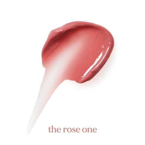 Image 1 - A glossy peachy-pink makeup swatch is displayed on a white background with the text the rose one. Image 2 - A white cosmetic tube with a blob of pink cream squeezed from its opening, with callouts pointing to text SPF 50, SHEA BUTTER, HYALURONIC ACID, SQUALANE, and text on the tube label that reads the rose one, SPF 50 TIN, SHEA BUTTER HYALURONIC ACID. Image 3 - A white tube of lip balm with a blob of pink tinted balm squeezing out of the top, alongside text describing its features: the rose one SPF 50 TINTED LIP BALM, SQUALANE An ultra-hydrator that helps maintain the skin’s balance, HYALURONIC ACID Plumping hydration, strengthens and supports the skin barrier, SHEA BUTTER Helps to soften, nourish and moisturise the skin, SPF 50 High protection from UVA/UVB, Infrared rays, blue light and pollution, and vertical text on the tube reading SPF the rose one SHEA BUTTER HYALURONIC.