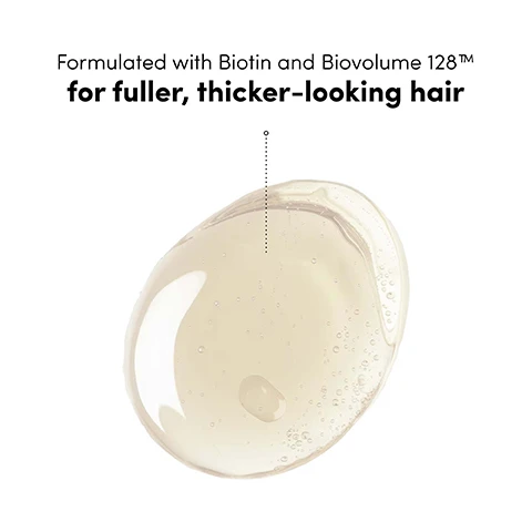 Image 1 - A drop of clear, light yellow liquid with small bubbles is shown on a white background, with a dotted line pointing from the text above to the liquid, reading: Formulated with Biotin and Biovolume 128™ for fuller, thicker-looking hair. Image 2 - A split image shows a persons back with long dark brown hair, on the left the hair appears straight and flat, and on the right the hair has noticeable volume and soft waves, with text Before, After, *Using Boost Therapy Shampoo and Conditioner as part of a regimen, and UNRETOUCHED. Image 3 - A smiling woman with long dark hair, wearing a light blue textured swimsuit, holds a light blue shampoo bottle in her left hand and a matching conditioner bottle in her right hand, standing in front of pink flowers and green leaves with a blurred beach in the background; visible text includes Revitalize fine, thinning hair into luscious, bouncy locks with a 24-hour volumizing effect, COCO & EVE BOOST THERAPY HAIR VOLUMIZING SHAMPOO for fine, flat hair, 250ml e 8.4 fl. oz, and COCO & EVE BOOST THERAPY HAIR VOLUMIZING CONDITIONER for fine, flat hair, 250ml e 8.4 fl. oz. Image 4 - A smiling woman in a light blue one-shoulder swimsuit sits in an infinity pool with lush tropical trees in the background, next to two purple product bottles on the pools edge, with overlaid text Cleanses and fortifies for maximum volume Helps support hair strength and growth, and the bottles are labeled COCO & EVE BOOST THERAPY. Image 5 - A light purple shampoo bottle with a white cap, labeled Coco & Eve Boost Therapy, sits on a vibrant pink gerbera daisy, with droplets of water on the bottle and flower petals, against a soft blue background, with visible text on the bottle reading COCO & EVE BOOST THERAPY HAIR VOLUMISING SHAMPOO SHAMPOOING VOLUMISANT BIOVOLUME 128™ + BIOTIN FOR FINE AND THINNING HAIR Net 288 ml / e 9.47 fl. oz. US, and text on the right side of the image stating Clinically proven results: 135% more volume 83% in hair density. Image 6 - A light blue Coco & Eve Boost Therapy Hair Volumising Shampoo bottle is shown in a glass beaker with fresh coconut slices, pink flowers, and green mint leaves, accompanied by the text Infused with fatty acid-rich coconut oil to help fortify volumized hair and on the bottle Coco & Eve Boost Therapy Hair Volumising Shampoo, Shampooing Volumisant, Volume 128 Biotin, For Fine and Thinning Hair, Net 288 ml / e 9.47 fl. oz. US.