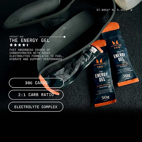Image 1 - Image of three packets of MyProtein Pro Energy Gel in blood orange flavor displayed on a dark surface, with the text describing the products features, including fast-absorbing carbohydrates, a 2:1 carb ratio, and an electrolyte complex.
Image 2 - A person in a black athletic outfit runs on a track with a grassy field and trees in the background, and the visible text reads OPTIMALLY DOSED, HIGHEST QUALITY, NO COMPROMISES.