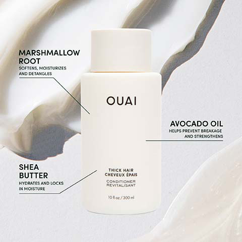 A white bottle of Ouai Thick Hair Conditioner Revitalisant, 10 fl oz / 300 ml, is shown with callouts describing Marshmallow Root softens, moisturizes and detangles, Avocado Oil helps prevent breakage and strengthens, and Shea Butter hydrates and locks in moisture.