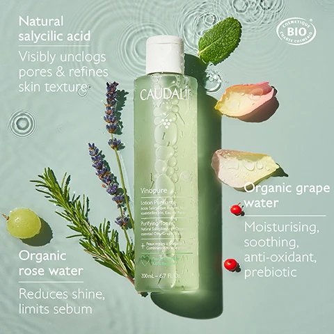Image 1 - A bottle of CAUDALI Vinopure Lotion Purifying Toner is surrounded by green leaves, lavender, and rose petals, with visible text stating Natural salicylic acid visibly unclogs pores & refines skin textures, Organic rose water reduces shine, limits sebum, and Organic grape water moisturising, soothing, anti-oxidant, prebiotic.
              Image 2 - A green bottle of Caudalie Vinopure Blemish Control Salicylic Serum is displayed surrounded by green grapes, lavender, and leaves, with text highlighting Natural salicylic acid: Unclogs pores and refines skin texture, Niacinamide: Tightens pores, and Grape Polyphenols: Antioxidant.
              Image 3 - Image shows a side-by-side comparison of a persons face before and after using the Vinopure Purifying Toner for 56 days, with the left side showing a shiny complexion and the right side showing less shine, along with the text 90% saw their skin less shiny and an untextured result after applying the Vinopure Purifying Toner 2X a day for 56 days.
              Image 4 - A side-by-side comparison shows a persons face before and after six months of using Vinopure Serum, with visible improvement in skin texture and clarity, and text at the bottom reads Unretouched results after applying the Vinopure Serum 2X a day for 6 months.
              Image 5 - A side-by-side comparison image showing a persons cheek before and after 7 days of using Vinopure Serum, with visibly reduced spots on the after side, accompanied by the text 2X less spots after 1 week* and Unretouched results after applying the Vinopure Serum 2X a day for 7 days.
              Image 6 - A man is gently using a cotton pad on his face, showcasing his clear skin, with text that reads Clear, shine-free skin and 90% saw their skin less shiny*.
              Image 7 - A young woman smiles while applying a skincare product to her face, with text on the right stating Visible results after 1 week and 2X less spots*.
              Image 8 - Image shows a collection of skincare products arranged on a light background, including a purifying gel cleanser, purifying toner, blemish control salicylic serum, moisturizing mattifying fluid, and salicylic spot solution, with labels numbered 1 to 5 indicating their use: 1. Cleanse, 2. Purify, 3. Correct, 4. Mattify, 5. Target.