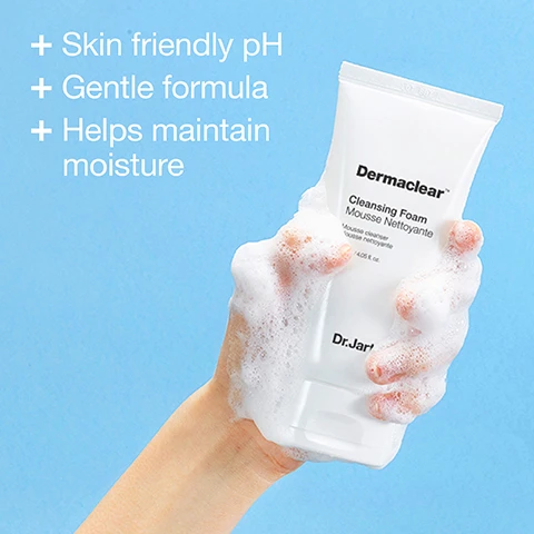 Image 1 - A hand holding a bottle of Dermaclear Cleansing Foam, surrounded by foam, against a light blue background with text that reads Skin friendly pH, Gentle formula, Helps maintain moisture.
              Image 2 - Three tubes of Dr. Jart+ Dermaclear pH Foam Cleanser are arranged in a wire basket, with a white towel beneath them and the text Formulated with Glycerin in the top right corner.