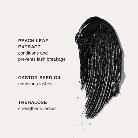 A black mascara-like stroke is shown on a light background, with visible text reading 'PEACH LEAF EXTRACT conditions and prevents lash breakage,' 'CASTOR SEED OIL nourishes lashes,' and 'TREHALOSE strengthens lashes.'