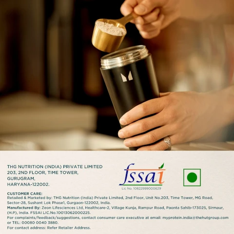 Hand pouring powder from a scoop into a black shaker bottle THG NUTRITION (INDIA) PRIVATE LIMITED 203, 2ND FLOOR, TIME TOWER, GURUGRAM, HARYANA-122002. CUSTOMER CARE: Retailed & Marketed by: THG Nutrition (India) Private Limited, 2nd Floor, Unit No.203, Time Tower, MG Road, Sector-28, Sushant Lok Phase1, Gurgaon-122002, India. Manufactured By: Zeon Lifesciences Ltd, Healthcare-2, Village Kunja, Rampur Road, Paonta Sahib-173025, Sirmaur, (H.P.), India. FSSAI LIC.No.10013062000225. For complaints/feedback/suggestions, contact consumer care executive at email: myprotein.india@thehutgroup.com or TEL: 00080 0040 3880. For contact address: Refer Retailer Address. fssai Lic No. 10822999000629 Vegetarian symbol green square green circle.