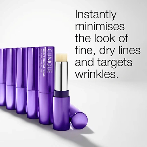 Image 4 - A row of several purple balm sticks, with one open in the foreground revealing a pale yellow balm, along with the text CLINIQUE smart clinical repair AM/PM retinoid balm Instantly minimises the look of fine, dry lines and targets wrinkles. Image 5 - The image shows a textured swatch of a pale, creamy product on a white background, featuring a gear icon above the word plump and a wavy line icon above the word smooth. Image 6 - A close-up of a person with freckles holding a purple Clinique tube on their forehead, with text on the tube reading CLINIQUE smart clinical repair AM/PM retinoid balm baume retinoid matin/soir and additional text on the image that says Use 2x a day Apply to lines, from first signs to deeper wrinkles Dont use directly on lips. Image 7 - The image shows a Clinique Smart Clinical Repair AM/PM Retinoid Balm stick in a purple tube with the cap off, revealing the white balm, next to the cap, accompanied by text that reads Formula Facts, Clinical expertise: Dermatologist tested, Safe for sensitive skin, Allergy tested, Fragrance free, Free of: Fragrance, Sodium lauryl sulfate, Sodium laureth sulfate, Drying alcohol, Gluten, and the product text CLINIQUE smart clinical repair AM / PM retinoid balm baume rétinoïde matin / soir. Image 8 - A close-up of a persons face shows a hand applying a stick product near the outer corner of their eye, with the visible text Targets the look of lines.