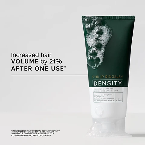 Image 1 - A tube of Philip Kingsley Density thickening shampoo with a dark green label and bubbles around it, featuring the text Increased hair VOLUME by 21% AFTER ONE USE* below, and an asterisk indicating additional information about the results.
              Image 2 - A person holds a tube of Philip Kingsley Density hair product while displaying a small amount of the product in their other hand; visible text includes a customer review stating My hair feels THICK, FULLER and more VOLUMISED. Its a very noticeable difference. I noticed this difference after the 1st wash and a note that says *USER TRIAL PANEL COMMENT.
              Image 3 - Image shows the back view of a persons hair styled in two different looks; the left side labeled Before displays messy, unkempt hair, while the right side labeled After shows a more polished, voluminous hairstyle.
              Image 4 - A close-up of a hand applying water and shampoo to wet hair, accompanied by the text TRICHOLOGIST TIP Wet hair and lather well with a gentle kneading of the scalp for 60 seconds.