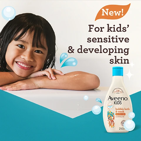 Image 1 - A smiling child with long, dark hair rests their arms on a white surface, next to a bottle of Aveeno Kids bubble bath and wash labeled for kids sensitive and developing skin, with bubbles and a splash graphic in the background. Visible text reads New! For kids sensitive & developing skin.
              Image 2 - A bottle of Aveeno Kids bubble bath and wash, featuring a blue lid and a label that includes the text Tear-free, Free from sulphates, soap & dyes, and Gentle fragrance, alongside a pediatrician and dermatologist tested logo.
              Image 3 - A clear hexagonal dish containing clusters of dried oat flowers with the text Enriched with soothing oat above.
              Image 4 - A bottle of Aveeno Kids bubble bath and wash, featuring an octopus character, is shown against a turquoise background with bubbles alongside the text that reads Gently washes away dirt, whilst nourishing skin.
              Image 5 - A bottle of Aveeno Kids bubble bath and wash is shown against a teal background, featuring a character made of colorful shapes and the text Recyclable Bottle and 50% Recycled Plastic bottle.
              Image 6 - Image shows three Aveeno Kids product bottles labeled bubble bath and wash, shampoo, and conditioner, positioned on a light background with playful elements; visible text includes Proven to cleanse, protect & help nourish kids’ developing skin, scalp and hair.