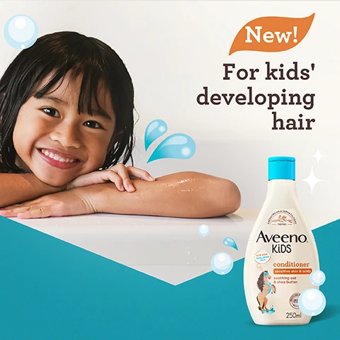 Image 1 - A smiling child with wet hair rests on a white surface while a bottle of Aveeno Kids conditioner is displayed next to her, with text reading New! For kids developing hair.
              Image 2 - Image of dried oat flowers arranged in a hexagonal dish next to a small bowl of shea butter, with the text With soothing oat & shea butter displayed above.
              Image 3 - Image of two bottles of Aveeno Kids shampoo and conditioner on a bathroom countertop, with a wooden hairbrush and a playful orange mask in the background, featuring the text that reads: Use with AVEENO® KiDS Shampoo for triple benefits: softens, nourishes & helps manageability.
              Image 4 - A cartoon horse wearing a mask and cape is next to a bottle of Aveeno Kids conditioner, which is labeled as hydrating, nourishing, and easy to manage, with accompanying text that reads for kids sensitive skin & scalp soothing oat & shea butter.
              Image 5 - A bottle of Aveeno Kids conditioner is shown, featuring a horse wearing a blue mask and a girl with curly hair, with visible text stating 50% recycled plastic bottle and recyclable bottle.
              Image 6 - A bottle of Aveeno Kids conditioner is shown against a teal background, with text highlighting features: tear-free, free from dyes, and gentle fragrance; the bottle is 250 ml and shows a child with wavy hair.