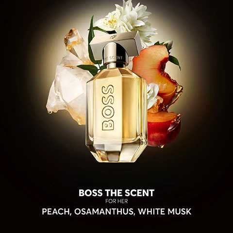 Image 2 - A perfume bottle labeled BOSS THE SCENT FOR HER is surrounded by peach slices, white flowers, and crystal-like elements, with the text PEACH, OSAMANTHUS, WHITE MUSK below.
              Image 3 - A perfume bottle labeled BOSS THE SCENT is prominently displayed on a reflective surface with text indicating new and old bottle designs.
              Image 4 - A sleek perfume bottle with rose gold detailing is displayed against a dark background, featuring the word BOSS prominently, along with a quote praising the scents elegance and floral notes, and a five-star rating at the bottom.
              Image 5 - A display of four perfume bottles labeled BOSS, with descriptions for each: Eau de Parfum, Magnetic Eau de Parfum, Parfum, and Elixir, accompanied by scent family and notes below.
              Image 6 - A man and woman pose together, both dressed in stylish black outfits, next to two bottles of the BOSS THE SCENT fragrance, with visible text reading BOSS THE SCENT and THE NEW REFILLABLE FRAGRANCES.
              Image 8 - Image shows a BOSS The Scent perfume bottle positioned on a black surface, with text stating that refilling the bottle reduces packaging impact by 54% greenhouse gas emissions, 56% fossil resource use, and 62% land use, along with a footnote regarding life cycle assessment standards.