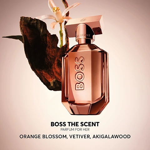 Image 2 - A bottle of Boss The Scent parfum for her, featuring a pinkish glass design, sits beside a dark rock and a white flower, with the text BOSS THE SCENT PARFUM FOR HER ORANGE BLOSSOM, VETIVER, AKIGALAWOOD displayed below.
              Image 3 - Image of a perfume bottle labeled BOSS with a sleek, reflective design set against a dark background, featuring a review that states Brilliant bottle design & colour. The scent is so intriguing, but sweet at same time. Love it. and five stars underneath.
              Image 4 - The image shows four distinct perfume bottles from the BOSS fragrance line, labeled Eau de Parfum, Magnetic Eau de Parfum, Parfum, and Elixir, with a black background and the heading BOSS THE SCENT above.
              Image 5 - A display of two perfume bottles on a circular surface with the name BOSS prominently featured, one bottle is in a light amber color and the other in a dark brown, accompanied by the text THE SCENT PARFUM above them.