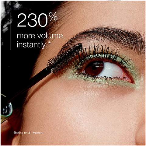 Image 1 - Close-up of an eye with thick, voluminous eyelashes and green eyeshadow, featuring text that reads 230% more volume, instantly, and a note stating Testing on 31 women.
              Image 2 - Image shows a close-up of a brown eye, with the top half labeled Before showing natural eyelashes, and the bottom half labeled After application displaying longer, more defined eyelashes.
              Image 3 - An image of a mascara brush against a backdrop of black mascara swirls with text that reads High-Def Wave Brush coats + combs every lash and Precision tip defines corner lashes.