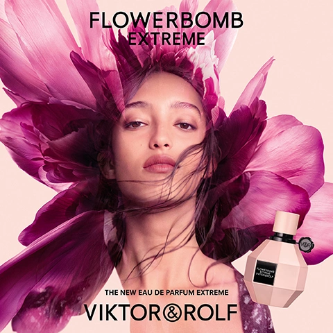 Image 1 - A close-up image of a woman with flowing hair surrounded by large pink flowers, featuring the perfume bottle on the right and the text FLOWERBOMB EXTREME at the top and THE NEW EAU DE PARFUM EXTREME VIKTOR & ROLF at the bottom.