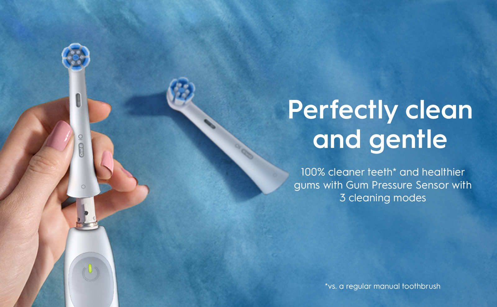 Oral-B iO2 electric toothbrush, highlighting its ability to provide 100% cleaner teeth compared to a regular manual toothbrush.