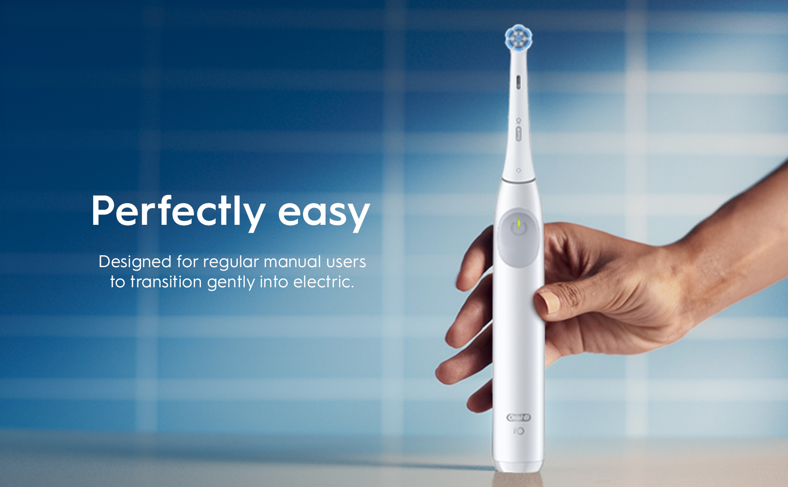 Oral-B iO2 electric toothbrush, emphasizing its ease of use and quiet operation.