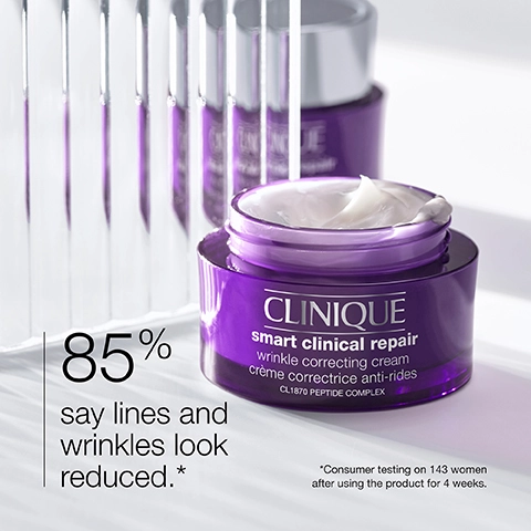 Image 1 - A close-up image of a purple jar of Clinique Smart Clinical Repair wrinkle correcting cream with visible text stating 85% say lines and wrinkles look reduced and *Consumer testing on 143 women after using the product for 4 weeks.