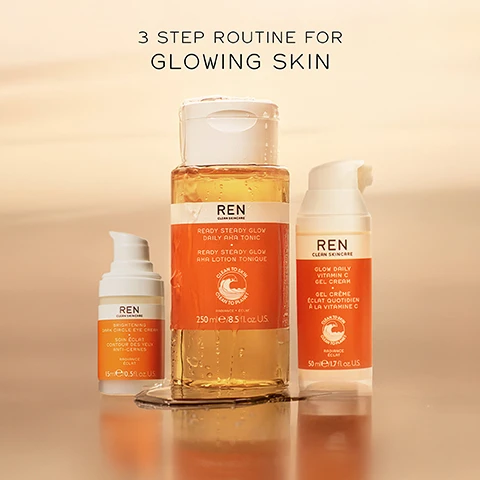 Image 1 - Three skincare products arranged on a surface, featuring a bottle of REN Ready Steady Glow Daily AHA Tonic, a tube of Brightening Dark Circle Eye Cream, and a pump bottle of Glow Daily Vitamin C Gel Cream, with the text 3 STEP ROUTINE FOR GLOWING SKIN displayed above.
              Image 2 - A bottle of REN Ready Steady Glow Daily AHA Tonic with an orange label sits on a surface, with the text above stating STEP 1 EXFOLIATE DEAD SKIN + CLOGGED PORES.
              Image 3 - A skincare product bottle labeled REN Clean Skincare Glow Daily Vitamin C Gel Cream with visible text stating STEP 2 HYDRATE + EVEN SKIN TONE and the creams volume is 50 ml / 1.7 fl oz U.S.
              Image 4 - A skincare product bottle for REN Clean Skincares Brightening Dark Circle Eye Cream is displayed with a blurred neutral background, featuring the text STEP 3 BRIGHTEN DARK CIRCLES + DEPUFF.