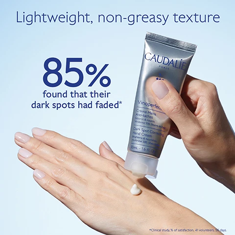 Image 1 - A hand is shown applying a white cream from a silver and blue tube labeled CAUDALIE Vinoperfect Dark Spot Correcting Hand Cream, with the text Lightweight, non-greasy texture and 85% found that their dark spots had faded* displayed above.
              Image 2 - A tube of skincare cream is positioned with a dollop of cream coming out of the opening, surrounded by dark purple berries, with text stating White peony brightens and evens skin texture, Viniferine 62x more effective than vitamin C corrects and prevents dark spots, and Avocado oil nourishes without greasy effect.
              Image 3 - Image shows two hand creams side by side: on the left, Vinoperfect Hand Cream with text that reads Anti-dark spots, Nourishes and protects, Enriched in Viniferine, and on the right, Vinotherapist™ Hand Cream with text that reads Repairing, Nourishes and protects, Enriched in Grape seed oil.
              Image 4 - Image of a Vinoperfect hand cream tube from Caudalie, positioned at an angle with a cap next to it; the text on the image reads How to recycle Vinoperfect Hand Cream and Recycle the whole packaging (tube + cap) with Terracycle.