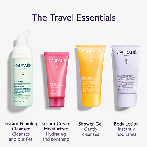 Image 1 - Image shows a collection of four travel-sized skincare products by Caudalie, labeled from left to right as follows: Instant Foaming Cleanser, Sorbet Cream Moisturizer, Shower Gel, and Body Lotion, with the title The Travel Essentials above the products.