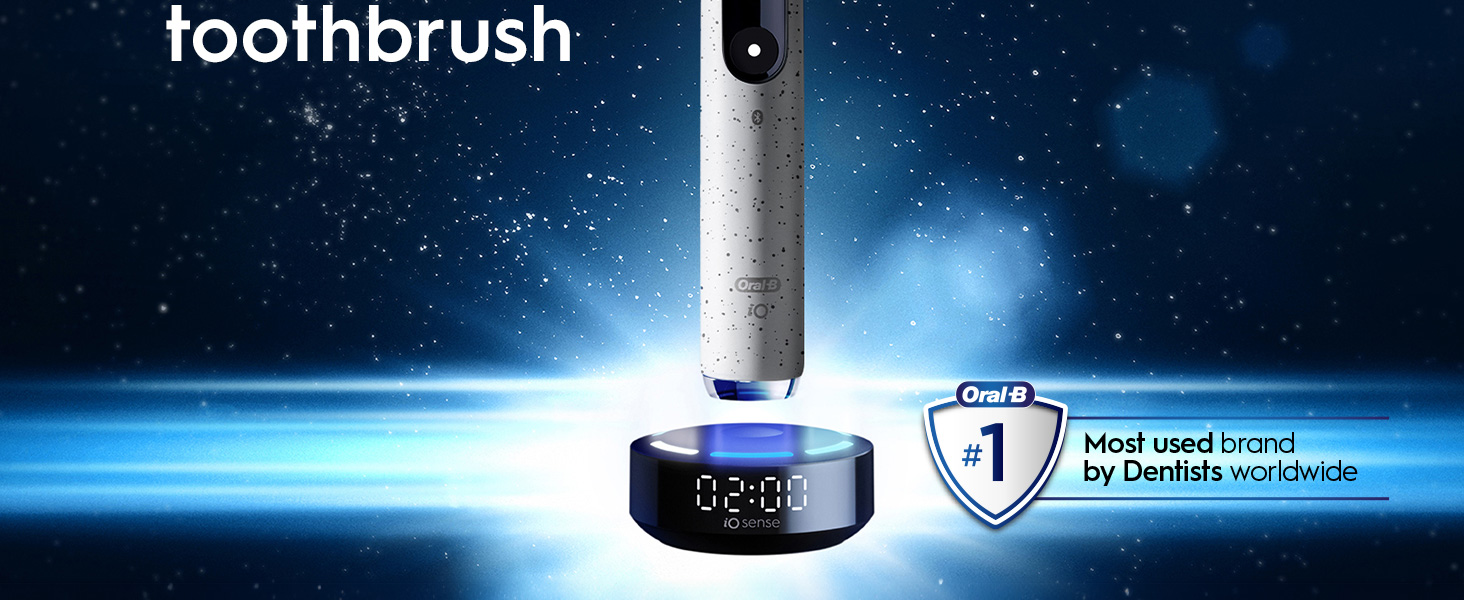 An Oral-B iO electric toothbrush is shown on its iO sense charger displaying 02:00, next to an Oral-B shield icon with the text #1 Most used brand by Dentists worldwide, with the word toothbrush at the top left.