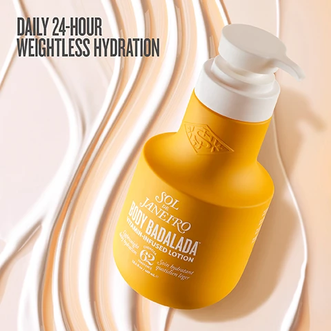 Image 1 - A yellow lotion bottle with a white pump cap is positioned against a swirled background of light cream colors, featuring the text DAILY 24-HOUR WEIGHTLESS HYDRATION at the top and BODY BADALADA VITAMIN-INFUSED LOTION on the bottle.
              Image 2 - Image features a green piece of Brazilian sugarcane, a puddle of translucent hyaluronic acid, and a Brazil nut with two halves, accompanied by the text: Brazilian Sugarcane boosts surface hydration, 7 Hyaluronic Acid Blend draws moisture deep, and Brazil Nut Oil nourishes with Vitamin E.
              Image 3 - A side-by-side comparison image showing the back of a person wearing a yellow bra; the left side labeled BEFORE displays the skin with visible texture, while the right side labeled AFTER shows smoother skin with the text 95% AGREE SKIN FEELS IMMEDIATELY NOURISHED in the corner.
              Image 4 - A popsicle topped with crushed pistachios and swirls of salted caramel, sitting on a light background with visible text reading irresistible scent pistachio salted caramel vanilla.
              Image 5 - Image of three bottles of body care products on a marble shelf, including a yellow bottle labeled Brazilian Play Body Wash, a pump bottle labeled Body Badalada Vitamin-Infused Lotion, and a spray bottle labeled 62 Perfume Mist, with the text Unstoppable in 3 Steps, 1 Cleanse & Nourish, 2 Weightlessly Hydrate, 3 Layer the Iconic Scent.
              Image 6 - Image shows two skincare products against a yellow background: a pump bottle labeled SOL DE JANEIRO BODY BADALADA with visible text stating weightless lotion for 24-hour hydration, and a jar labeled BRAZILIAN BUM BUM CREAM with visible text stating luscious cream for visibly firm, glowing skin, with creamy swirls above each product.
              Image 7 - A close-up image of a hand dispensing a cream from a bottle labeled BODY BALM with visible text stating DERMATOLOGIST TESTED PETA-CERTIFIED ANIMAL TEST-FREE & VEGAN FORMULATED WITHOUT MINERAL OIL PARABENS PHTHALATES.
              Image 8 - A flat lay image featuring several yellow-packaged skincare products, including two bottles of Sol de Janeiro Body Badalada lotion and a bottle of Cheirosa 62 perfume mist, with the text that reads Layer on the irresistible with Cheirosa 62™ perfume mist.
              Image 9 - A group of women are celebrating outdoors, with one woman in a white bikini and yellow skirt dancing, surrounded by others who are raising their arms; the image includes the text WEIGHTLESS HYDRATION FROM SUNRISE TO AFTER PARTY.
              Image 10 - A close-up of a smiling woman with long dark hair, applying moisturizer to her arm, with the text 95% AGREE SKIN FEELS HEALTHY, HYDRATED & SILKY SMOOTH, based on a consumer perception test with 106 participants.