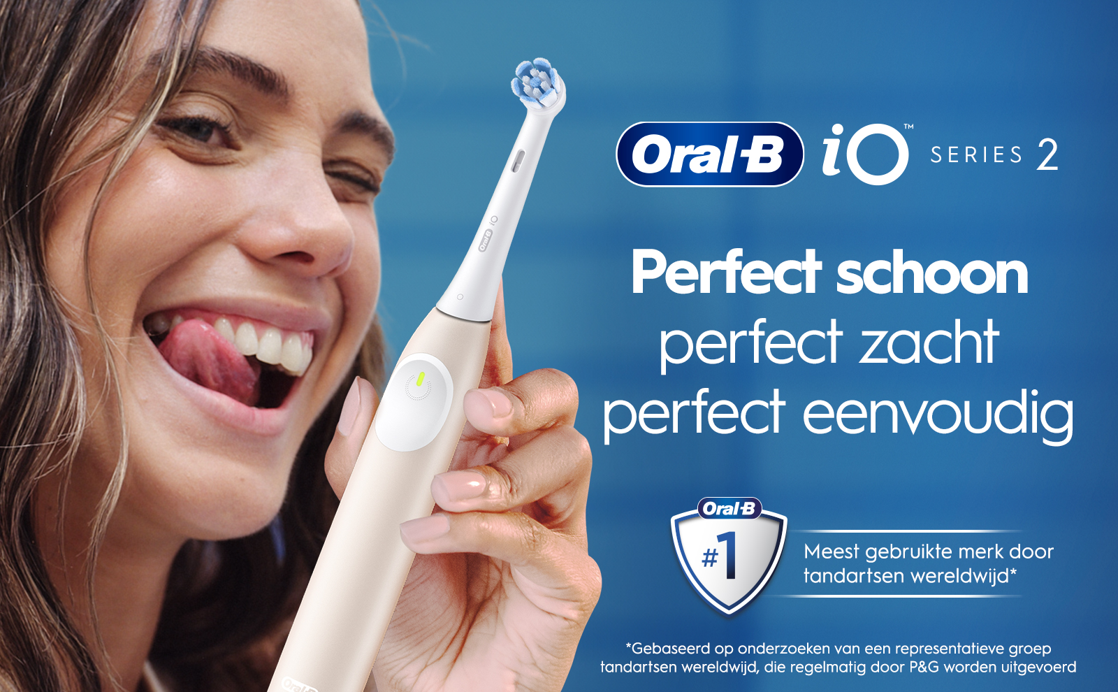 A woman is smiling with her tongue out while holding an Oral-B electric toothbrush, with text that reads Oral-B, Perfect schoon, perfect zacht, perfect eenvoudig, and Meest gebruikte merk door tandartsen wereldwijd.