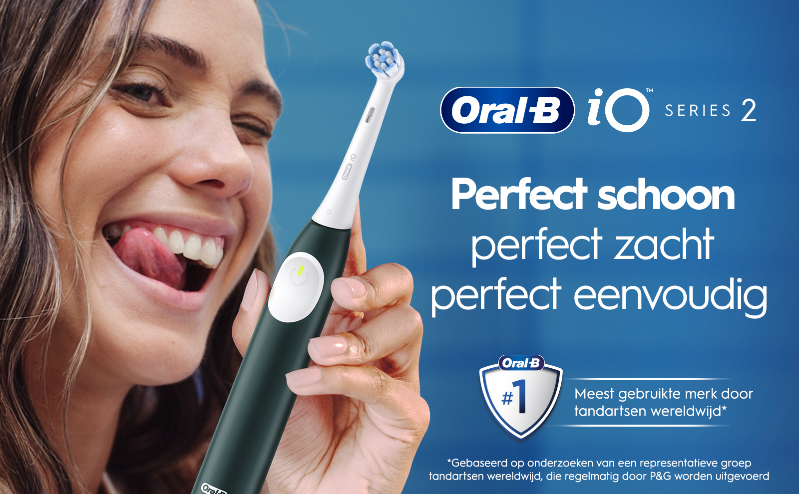 A woman is smiling with her tongue out while holding an Oral-B electric toothbrush, with text that reads Oral-B, Perfect schoon, perfect zacht, perfect eenvoudig, and Meest gebruikte merk door tandartsen wereldwijd.