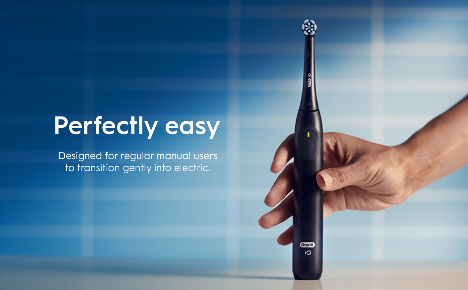 Oral-B iO2 electric toothbrush, highlighting its ability to provide 100% cleaner teeth compared to a regular manual toothbrush.