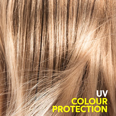 Image 2 - Close-up of shiny blonde hair with strands showcasing a smooth texture, with the text UV COLOUR PROTECTION displayed in yellow at the bottom right.
              Image 3 - A white bottle of Wella Professionals Invigo Sun Care shampoo with a yellow label, set against a yellow background, features icons and text indicating After Sun Care, Moisturizing, and Shine, with additional text stating with Pro-vitamin B5, after sun cleansing, and All hair types along with the volume of 300 ml.
              Image 4 - A tube of Wella Professionals Sun Care Conditioner on a yellow background, with icons and text highlighting benefits: after sun repair, nourishment, shine, and soft hair, along with visible product details and volume of 200 ml.
              Image 5 - A hand holds a yellow spray bottle labeled WELLA INVIGO SUN CARE UV PROTECTING SPRAY with icons and text indicating UV color protection, moisturizing, soft hair, and shine on a bright yellow background.
              Image 8 - Seven oval, translucent yellow capsules arranged on a white background, with the text Pro-Vitamin B5 and helps to moisturize hair after sun exposure.