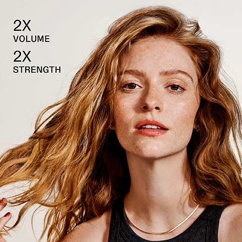 Image 1 - A woman with wavy, shoulder-length hair and freckled skin is shown, looking confidently at the camera, with the text 2X VOLUME and 2X STRENGTH to the left.
              Image 2 - Image shows two bottles of Olaplex hair care products, labeled as No. 4 Fine Bond Maintenance Shampoo and No. 5 Fine Bond Maintenance Conditioner, with text indicating to pair them for lasting volume.
              Image 3 - Image shows a comparison of a woman with long, wavy hair, with the left side labeled Before showing less defined hair texture and the right side labeled After showing smoother, shinier hair. Below the images, the text reads UNRETOUCHED IMAGES *Results will vary. Results achieved by cleansing with N°4FINE, conditioning with N°5FINE, then applying N°9 before styling, and finishing with OLAPLEX N°7.
              Image 4 - A woman with long, wavy red hair is posing, holding two bottles of hair products labeled OLAPLEX, with the text CLINICALLY PROVEN TO VOLUMIZE AND WEIGHTLESSLY HYDRATE visible in the image.