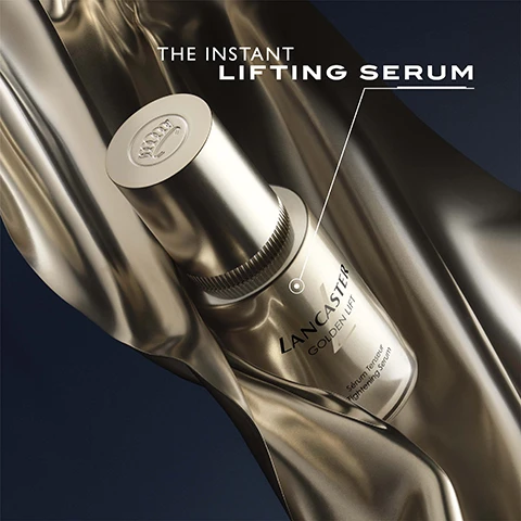 Image 1 - A golden serum bottle is placed against a smooth metallic background, with the text THE INSTANT LIFTING SERUM and LANCASTER GOLDEN JET displayed above and beside it.
              Image 2 - A woman with flawless skin is applying a serum to her cheek, holding a bottle of Lancaster Golden Lift serum next to her face, with the text 100% SAY SKIN IS TIGHTENED IN JUST 2 WEEKS and a note about consumer testing in the bottom right corner.
              Image 3 - A collection of cream jars with gold lids on a dark background, featuring text that reads ANTI-DARK CIRCLES ANTI-PUFFINESS.
              Image 4 - A close-up portrait of a young woman with smooth skin and dark hair is shown, highlighting her eyes, with text indicating 99% of participants saw lifted eyebrows in just 2 weeks and 97% saw lifted eye contour in the same time, along with the statement that the entire eye contour area is lifted.
              Image 5 - Image of a jar of Lancaster Golden Lift sculpting cream against a backdrop of draped metallic fabric, with text highlighting benefits: Lift & Sculpt, Reduce Dark Spots, Tighten Face Contours.
              Image 6 - A close-up of a womans face showcasing healthy skin, with the text stating +20% skin density, +19% redefined jawline, +18% skin elasticity, and the phrase skin is lifted & tightened at the bottom.
              Image 7 - Image depicts three skincare products from the Lancaster Golden Lift line, including a tightening serum, eye-lifting cream, and sculpting cream, with visible text listing their uses and application instructions.